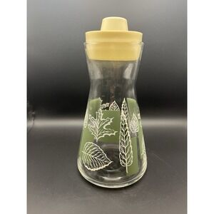 MCM vintage glass pitcher with leaf design, approximately 8x5 inches‎ size.